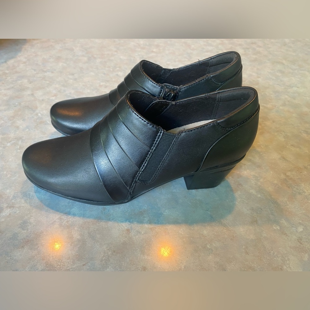 Clarks: Sleek Black Leather Women's Heeled Booties